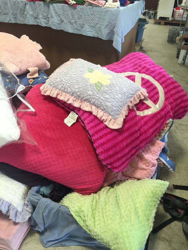 lot 59 image: Assorted Throw Pillows And Blankets