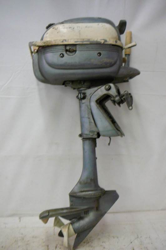 lot 40 image: Vintage Evinrude outboard motor model 3038 Stuck