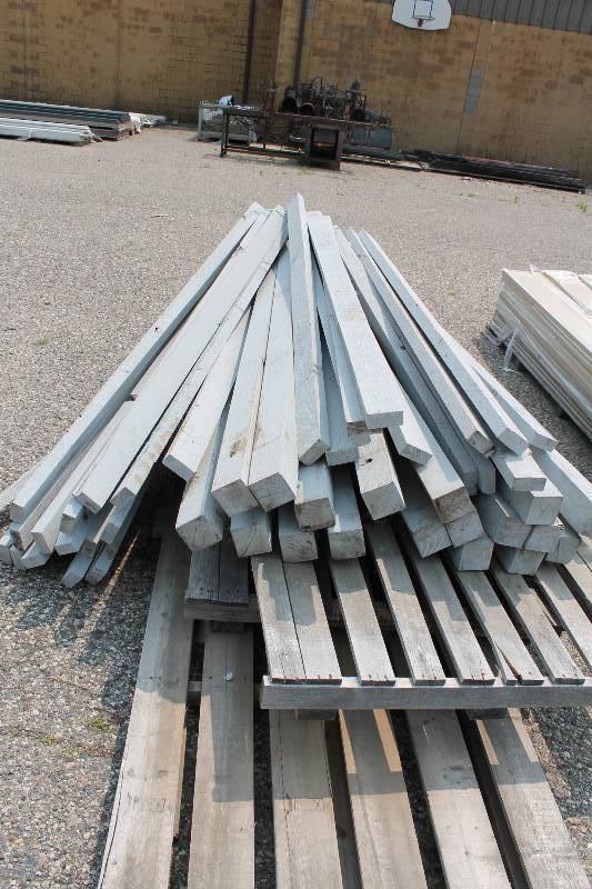 lot 48 image: Lot of Miscellaneous Wooden Posts All Cedar Primed On All Sides 4 x 4 x 8 2 x 4 x 8.