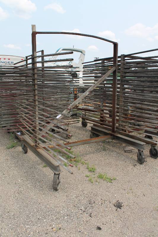 lot 102 image: Large Metal Racking Units wWheels Pole Shelves On Both Sides For SidingTubing Storage 94 x 80 x 90.