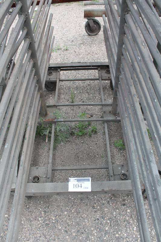 lot 104 image: Small Metal Racking Units wWheels Pole Shelves On Both Sides For SidingTubing Storage 24 x 85 x 90.