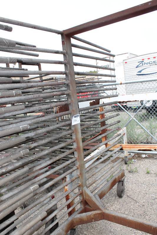 lot 108 image: Large Metal Racking Units wWheels Pole Shelves On Both Sides For SidingTubing Storage 94 x 80 x 90.