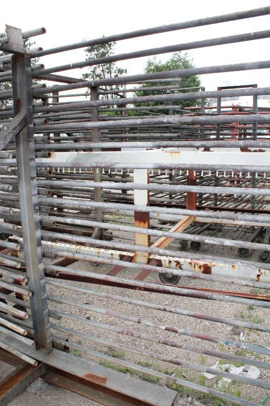 lot 114 image: Large Metal Racking Units wWheels Pole Shelves On Both Sides For SidingTubing Storage 94 x 80 x 90.