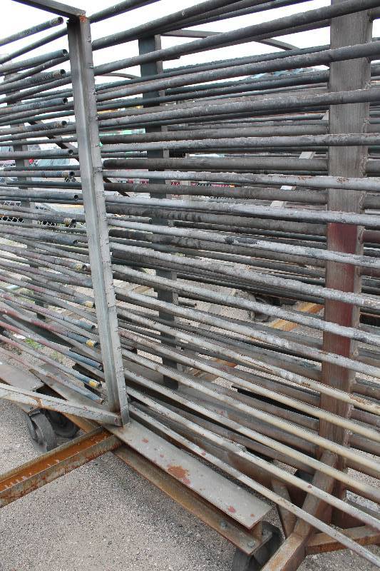 lot 113 image: Large Metal Racking Units wWheels Pole Shelves On Both Sides For SidingTubing Storage 94 x 80 x 90.