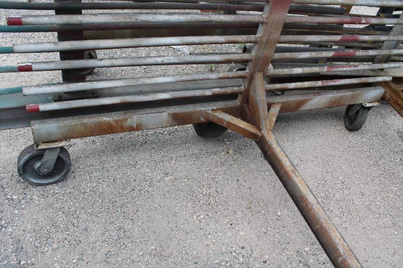 lot 111 image: Large Metal Racking Units wWheels Pole Shelves On Both Sides For SidingTubing Storage 94 x 80 x 90.