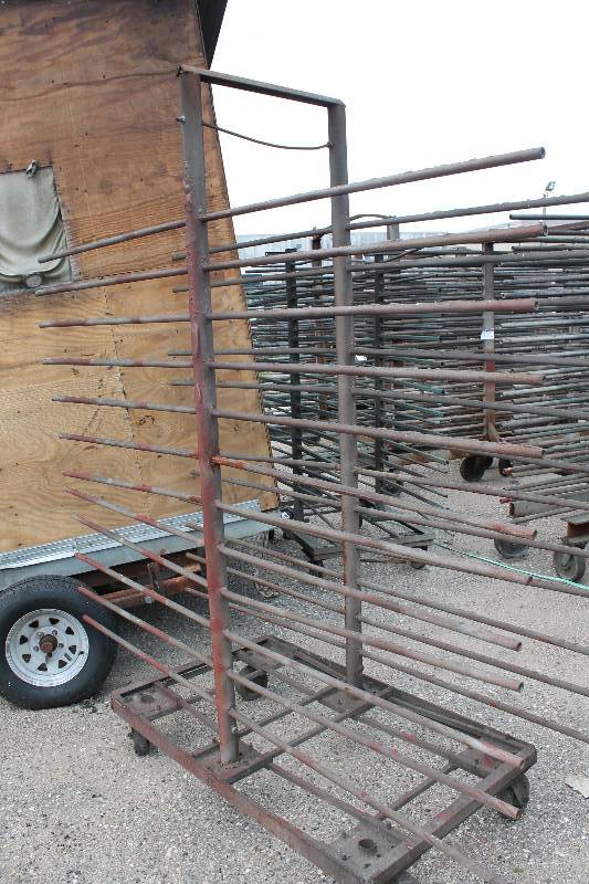 lot 115 image: Small Metal Racking Units wWheels Pole Shelves On Both Sides For SidingTubing Storage 24 x 85 x 90.