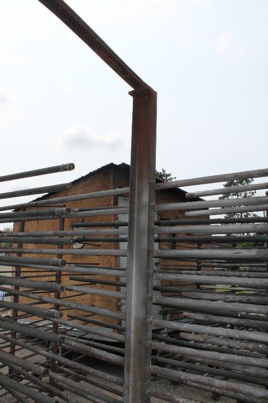 lot 118 image: Large Metal Racking Units wWheels Pole Shelves On Both Sides For SidingTubing Storage 94 x 80 x 90.