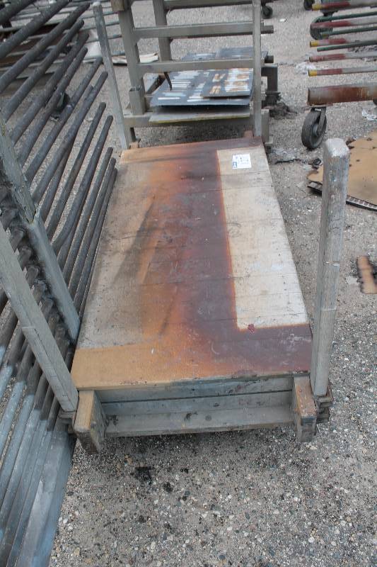 lot 127 image: Cart wCenter Wheels & base 4 Bars In Corners WoodMetal 72 x 32 x 45.