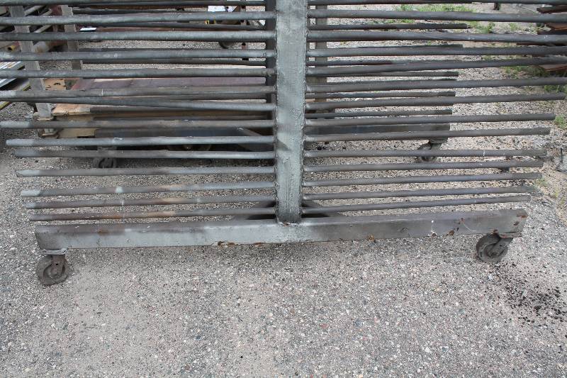 lot 121 image: Small Metal Racking Units wWheels Pole Shelves On Both Sides For SidingTubing Storage 24 x 85 x 90.