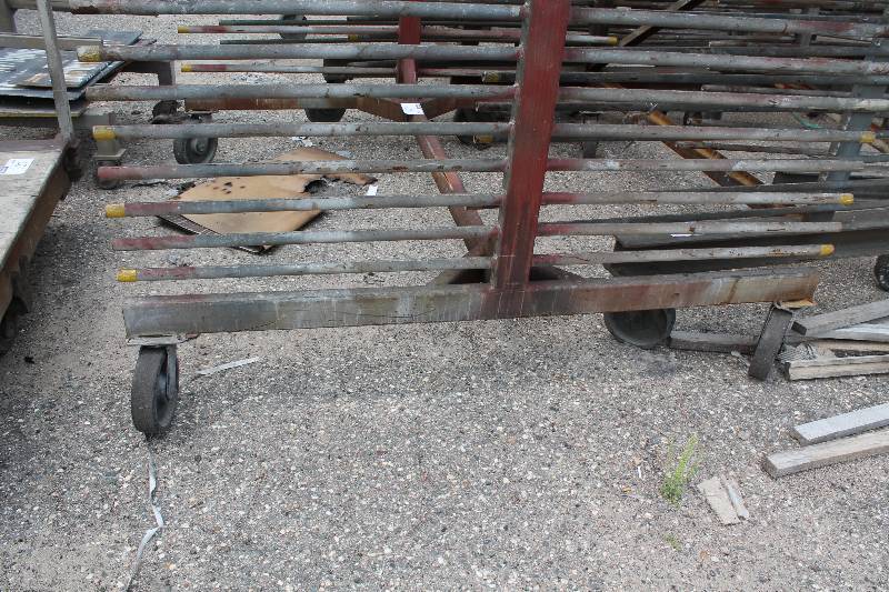 lot 128 image: Large Metal Racking Units wWheels Pole Shelves On Both Sides For SidingTubing Storage 94 x 80 x 90.