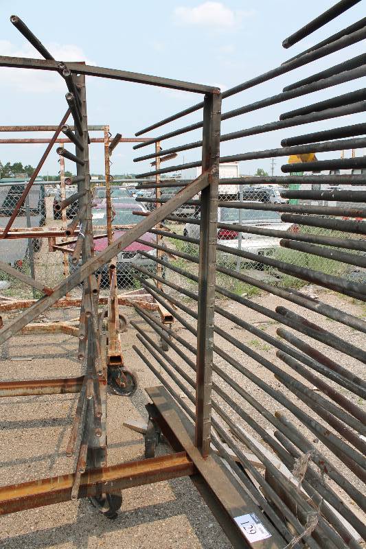 lot 129 image: Large Metal Racking Units wWheels Pole Shelves On Both Sides For SidingTubing Storage 94 x 80 x 90.