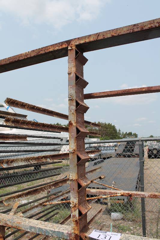 lot 131 image: Large Metal Racking Units wWheels Pole Shelves On Both Sides For SidingTubing Storage 94 x 80 x 90.