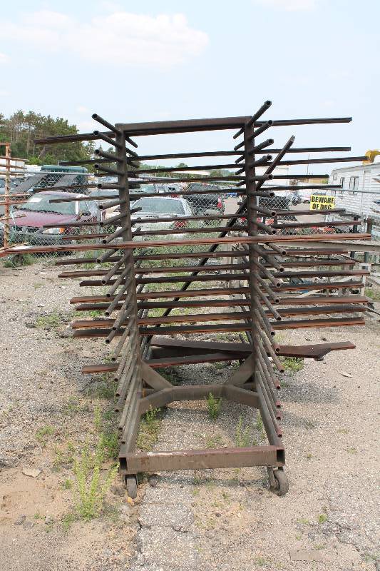 lot 133 image: Large Metal Racking Units wWheels Pole Shelves On Both Sides For SidingTubing Storage 94 x 80 x 90.