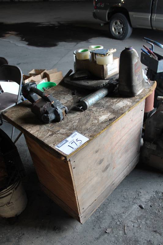 lot 175 image: Work Bench wWheels Wooden Lower Shelf Includes Contents Tape Rolls Paint Bucket And More 26 x 36 x 36.