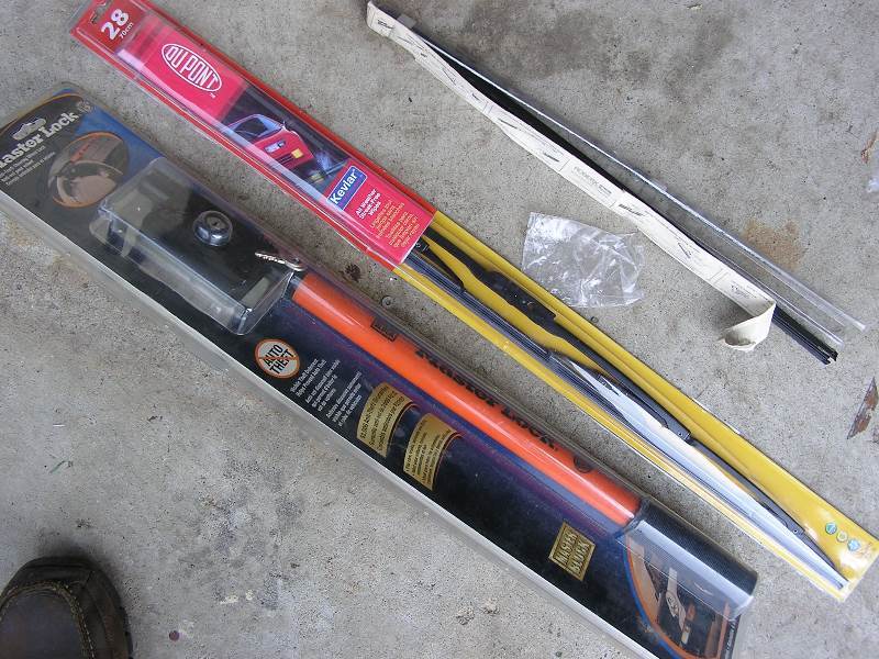 lot 57 image: MASTER STEERING WHEEL LOCK AND WIPER BLADES