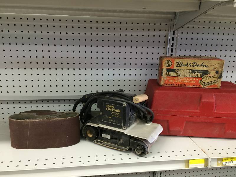 lot 179 image: craftsman belt sander with extra belts  and black and decker orbital sanding attachment