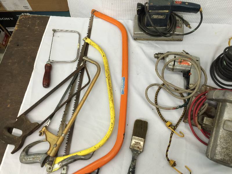 lot 235 image: saw vacuum extension cord ,drill  and sander