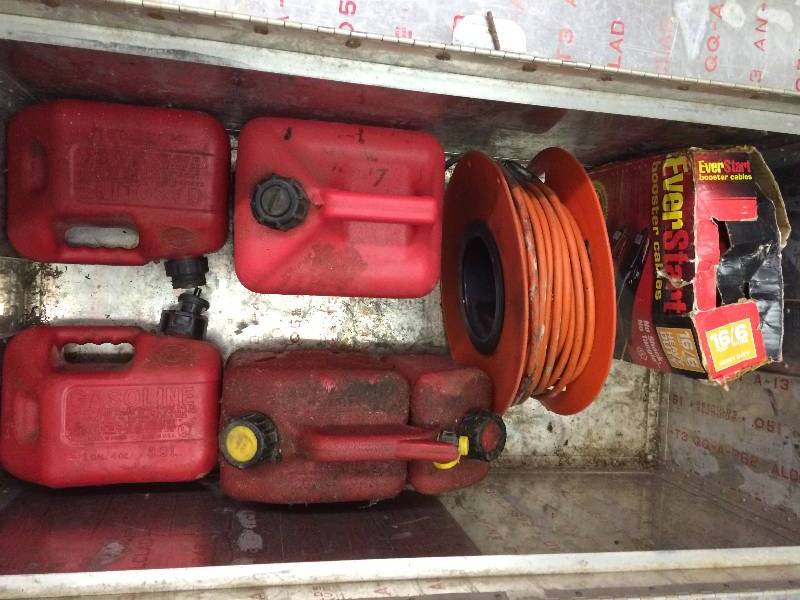 lot 240 image: aluminum truck box with gas cans extension cord and jump pack