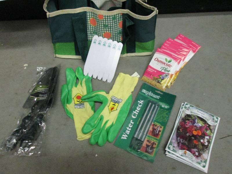 tote with seeds gloves 2 shovels pl...
