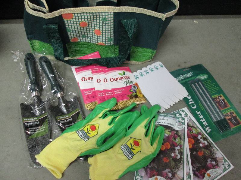 tote with seeds gloves 2 shovels pl...