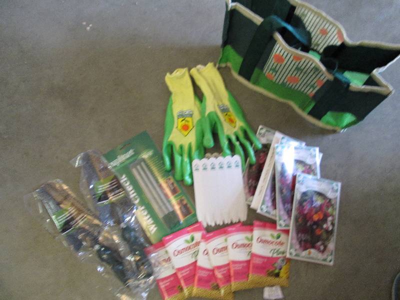 tote with seeds gloves 2 shovels pl...