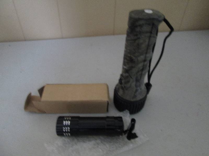 1 camo flashlight and black and sil...