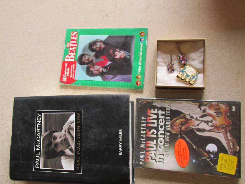 lot 66 image: Beatles books, unopened DVD and pin...
