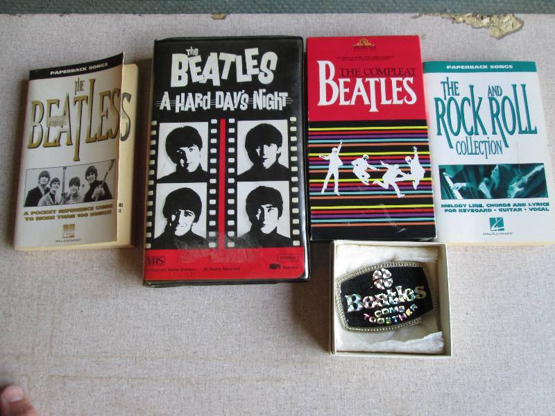 lot 114 image: Beatles movie, belt buckle and book...