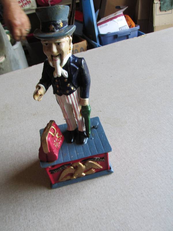 lot 132 image: Uncle Sam collector coin bank, push...