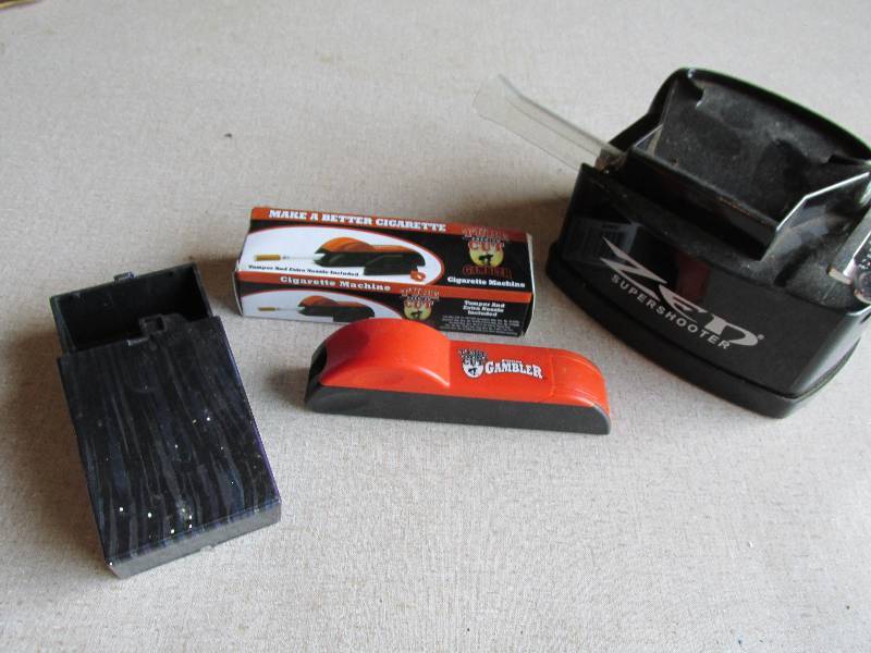 lot 152 image: Cigarette case, cutter and roller...