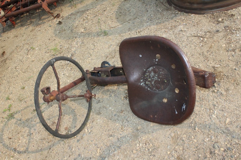 lot 15 image: Vintage Tractor Seat with Steering Wheel