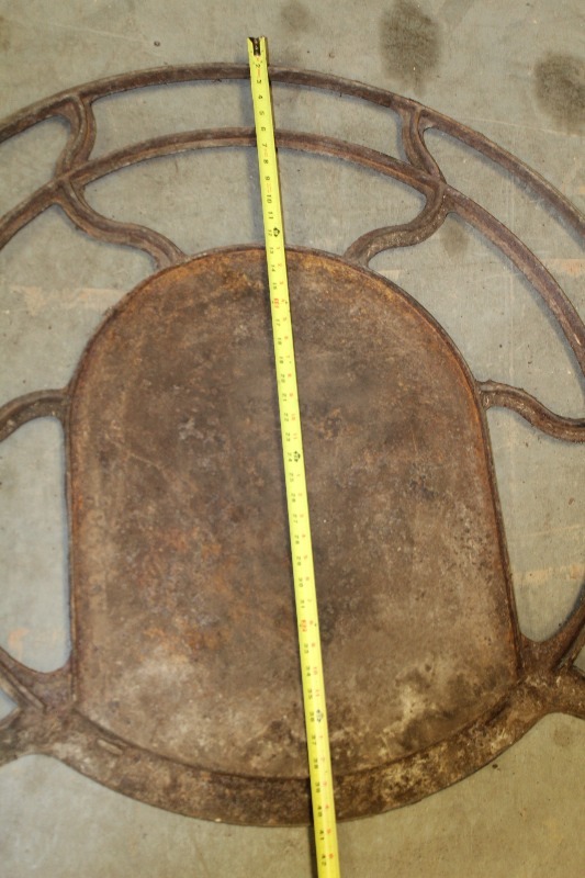 lot 65 image: Antique Cast Iron Floor Base for Potbelly Stove