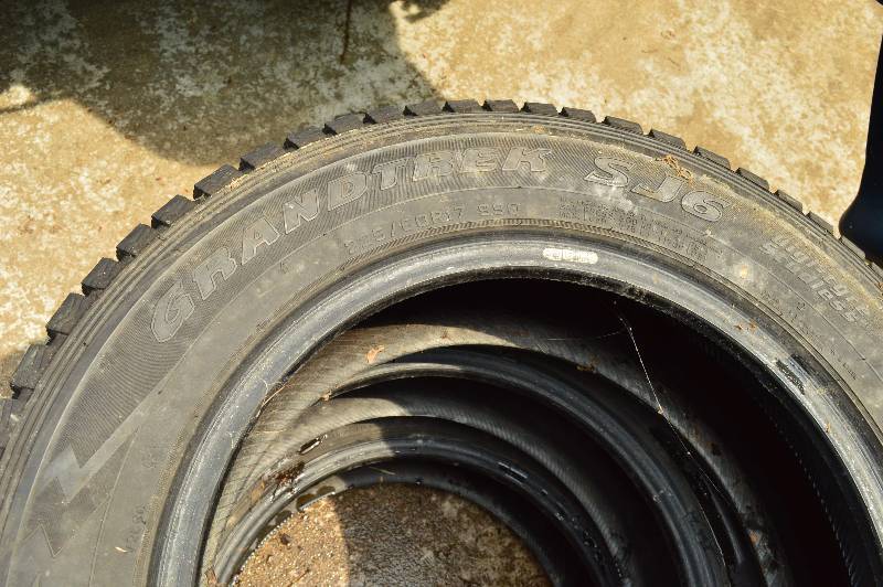 lot 4 image: Set of (4) Used Snow Tires Used On Lot #1 Not Including 1 Grand Trek Brand 22560R17 Directional Tires.