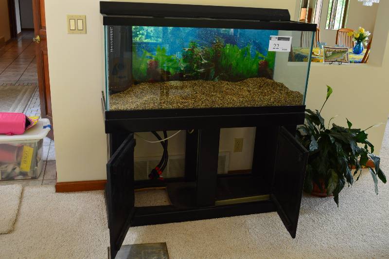 lot 22 image: 25 Gallon Aquarium On Stand wGravel Included Includes Heater, Overhead Light Emptied 48 x 19 x 51.