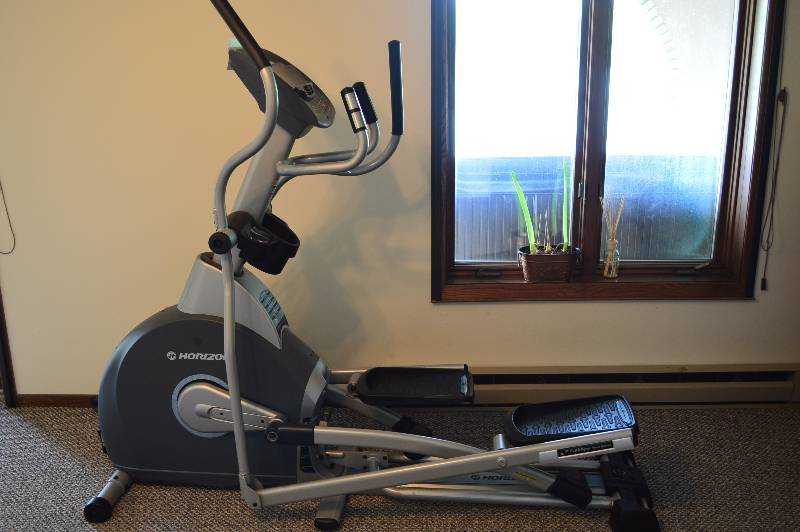 lot 34 image: Horizon Elliptical Workout Machine Tested & Operational 120V 60 Length 24 Width.