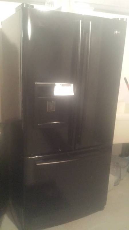 lot 40 image: LG Brand Fridge & Freezer wDoor Water & Ice Dispenser StoredFor 6 Years Lower Freezer Drawer Model LFD228685B Needs Repair 33 x 29 x 68.