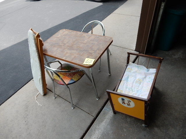 lot 67 image: Childs table and 2 chairs,  Ironing Board and wooden Iron, Wooden Crib with slide down side (needs some TLC.. Missing caster).