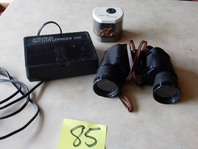 lot 85 image: Novar Nikko, 7 x 50mm 71 deg  binoculars.  Pencil sharpener, Battery Charger