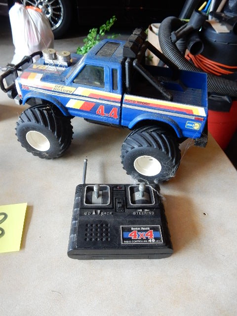 lot 93 image: Sentry Clock, Remote Control Car, True Value ERTL Car