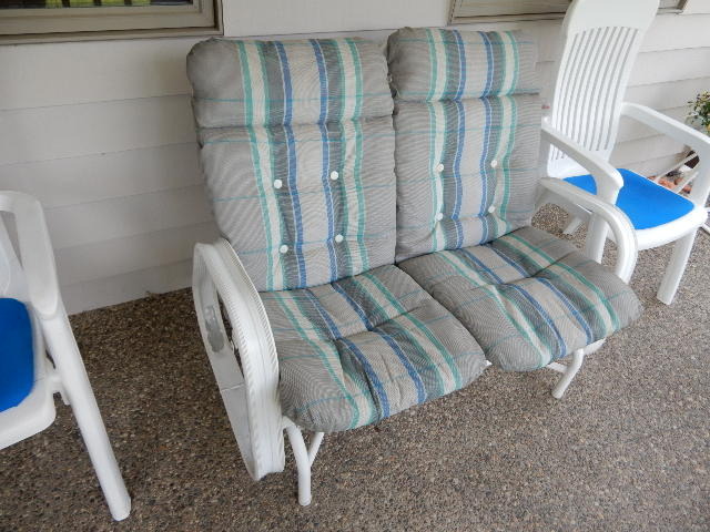 lot 106 image: Glider and 2 Resin Chairs.   Cushions included