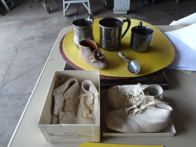 lot 531 image: Silver Cups and Baby Shoes