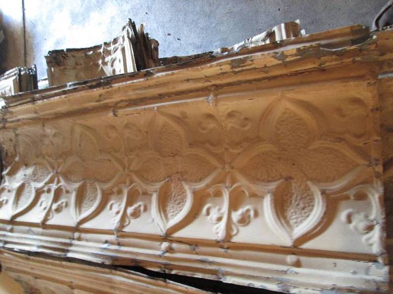 Strips of antique metal ceiling tin...