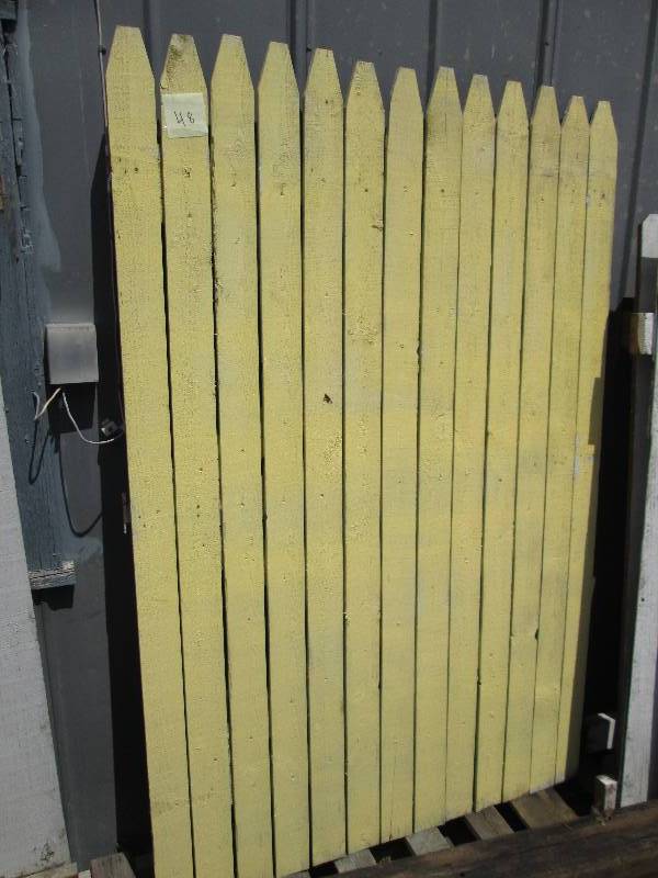 Gate with hinges, one side painted ...