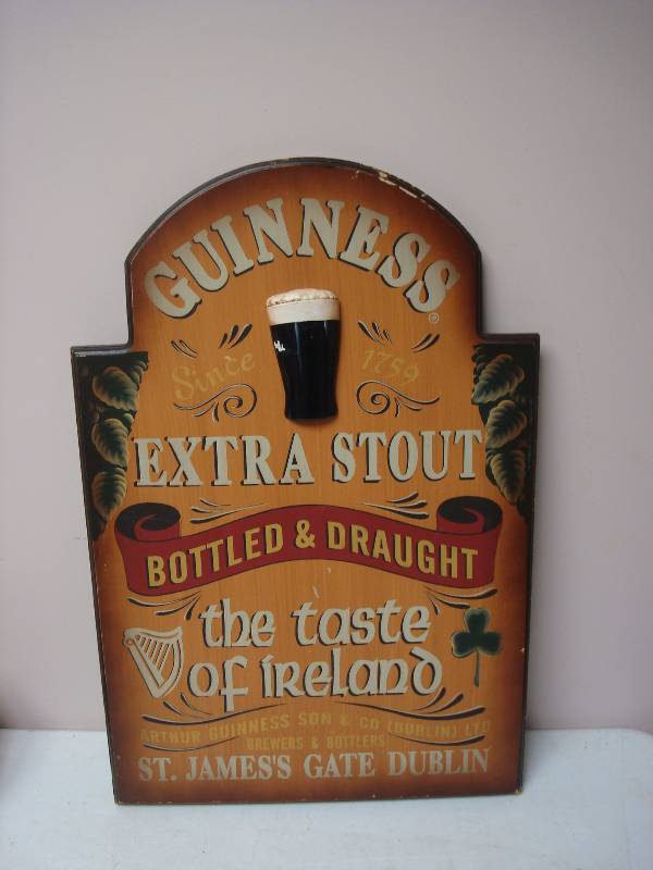 lot 29 image: Guinness Extra Stout Wood Sign, Some Wear
