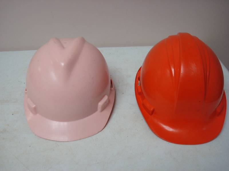 lot 143 image: Pair Of Hard Hats, One Pink