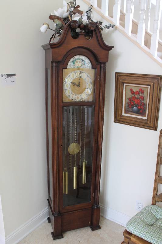 lot 3 image: Grandfather Clock wWooden Encasement & Ornamental Face Plate Featuring Dual Globe Images 76 Height.