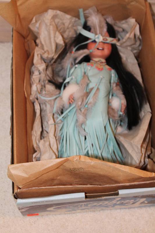 lot 37 image: Vasque Native American Girl Porcelain Doll wHeaddress & Dress.