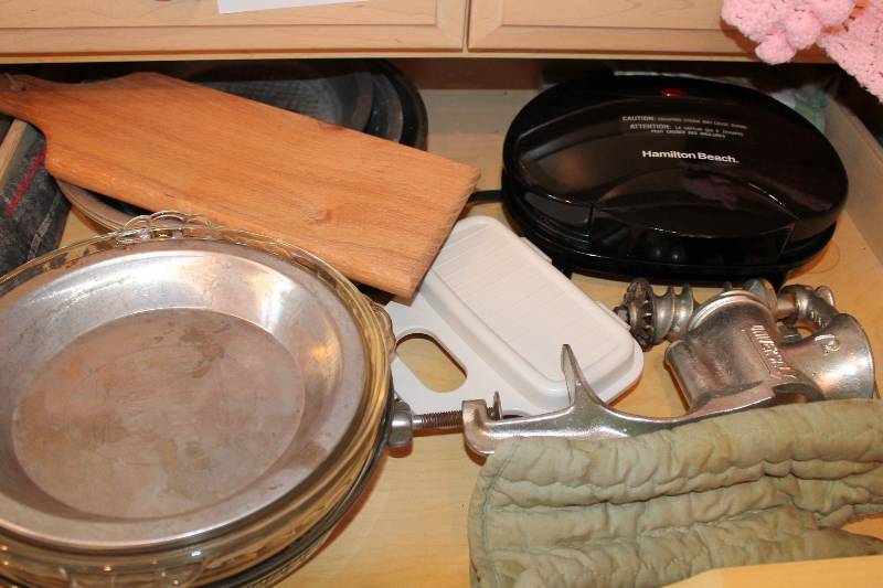 lot 140 image: Shelf Lot Including Hamilton Beach Panini Press Metal Meat Grinder Metal Dishes And More.
