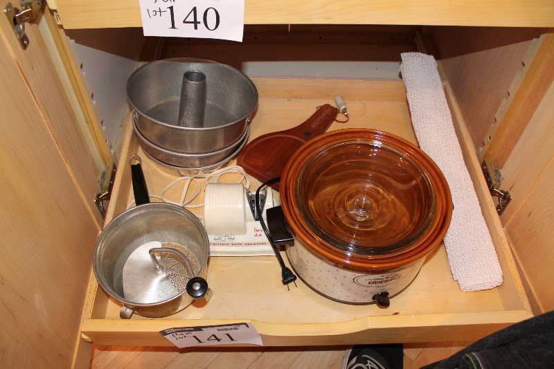 lot 141 image: Shelf Lot Including Metal Bundt Baking Pans Crock Pot Metal Cooking Pot wHandle And More.