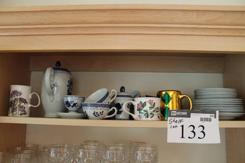 lot 133 image: Shlef Lot Including Collectible Dishware, Plates, Saucers, Cups, And More.
